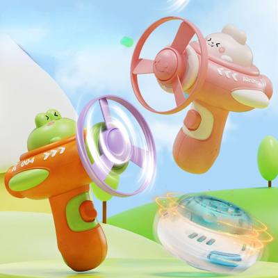Cross-border cartoon flying saucer gyroscope gun bamboo dragonfly ejection rotating gyroscope luminous flying disc two-in-one toy gun
