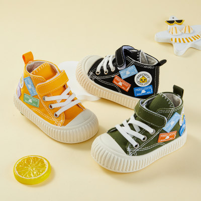 Pequeño pato amarillo zapatos para niños 2023 otoño zapatos de lona para niños de caña alta zapatos de tela con velcro de fondo suave para bebés venta al por mayor directa de fábrica