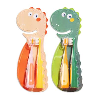 Cepillo de dientes de cerdas suaves para niños bebé escuela primaria estudiante dinosaurio de dibujos animados 2 piezas