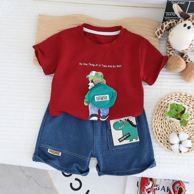 Novedad de verano, jersey de dos piezas a la moda informal para niños, camiseta de manga corta para niño, pantalones cortos vaqueros de dinosaurio para bebé