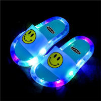 Zapatillas infantiles de cristal luminosas con cara sonriente.  Azul