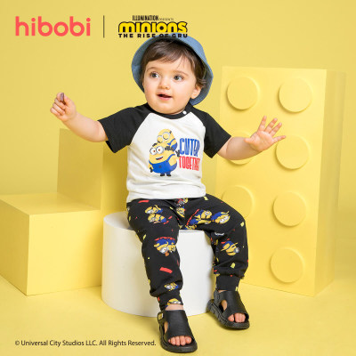 Minions × hibobi Tuta pantalone nera stampata per neonato