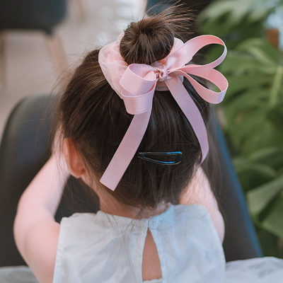 Corda per capelli con decorazione fiocco di bimba