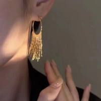 Gold long earrings with tassels for a stylish face, suitable for a niche design of earrings, with a sense of luxury and versatility. Earrings are high-end  Gold-color