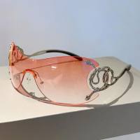 Neue personalisierte, modische, rahmenlose, einteilige Sonnenbrille mit Schlangenbeinen und einem Sinn für Technologie. Lustige Y2K-Sonnenbrille  Rosa