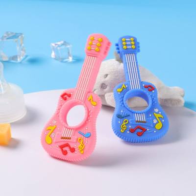 Guitar style silicone teether for baby oral period