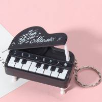 Mini piano de mano, piano pequeño jugable, consola de juegos electrónica, juguete llavero de regalo  Negro