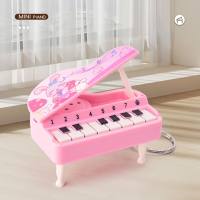Mini piano portátil, piano tocável, console de videogame, chaveiro de brinquedo para presente  Rosa