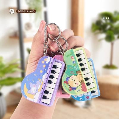 Mini piano de mano, piano pequeño jugable, consola de juegos electrónica, juguete llavero de regalo