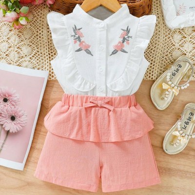Little girl's embroidered ruffle top and bow shorts