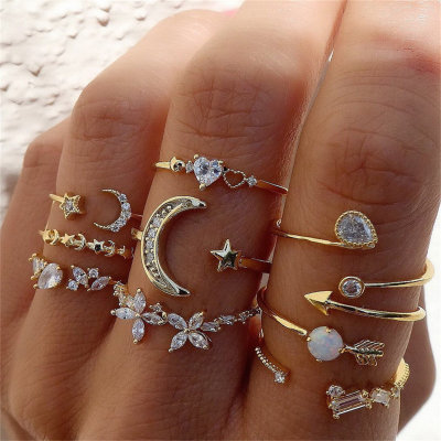 Set di anelli con foglia di perla e cuore di diamanti con stella e luna