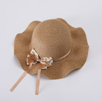 قبعة صيفية للأطفال من القش على شكل فيونكة مزخرفة بالزهور على الشاطئ  قهوة