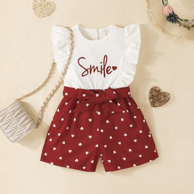 Pantalones cortos con tirantes y decoración de lazo en forma de corazón con estampado de letras para niños pequeños