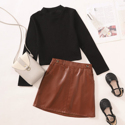 2-piece Kid Girl Solid Color Ribbed Long Sleeve Top & Solid Color A-line Leather Skirt