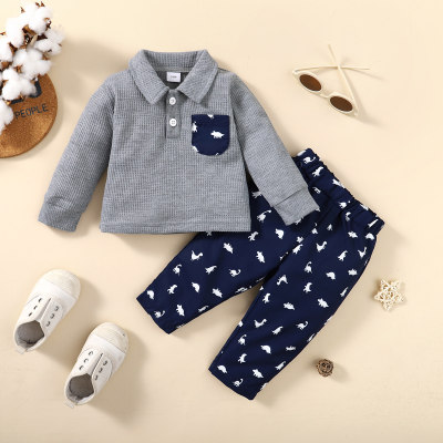 2-piece Baby Boy Waffle Solid Color Pocket Patchwork Long Sleeve Polo Shirt & Allover Dinosaur Pattern Pants