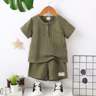 Camiseta infantil de manga curta de cor lisa de algodão puro de 2 peças e shorts combinando
