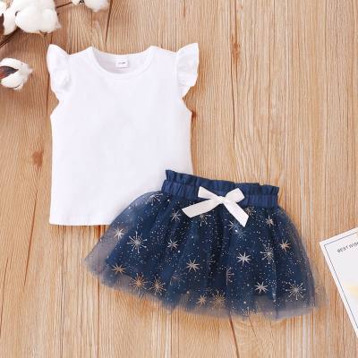 Solid color sleeveless top + star puffy skirt