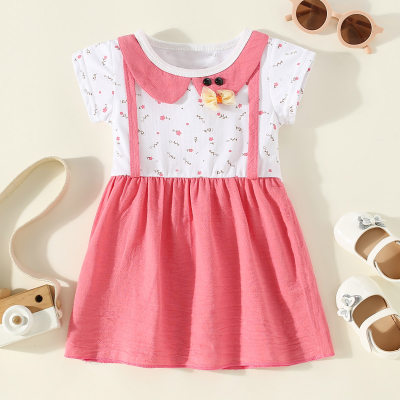 Vestido de manga corta con patrón de lazo de patchwork de bloque de color de algodón puro para niña pequeña