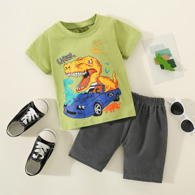 Camiseta infantil estampada de dinossauro e veículo de puro algodão para meninos de 2 peças e calça de cor lisa