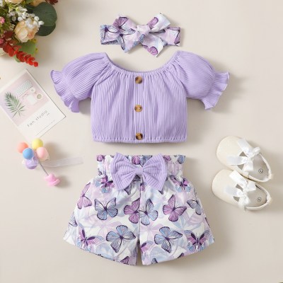 Blusa de manga corta con cuello oblicuo de color sólido para niña de 3 piezas y pantalones cortos florales y diadema con decoración de lazo