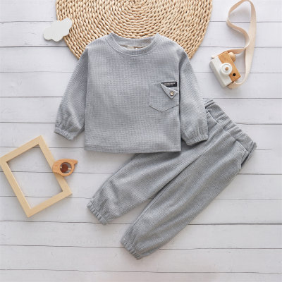 Children's spring and autumn solid color simple waffle personality leather label pocket long sleeve suit