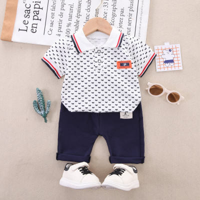2-piece Toddler Boy Pure Cotton Allover Bowknot Printed Short Sleeve Polo Shirt & Solid Color Pants