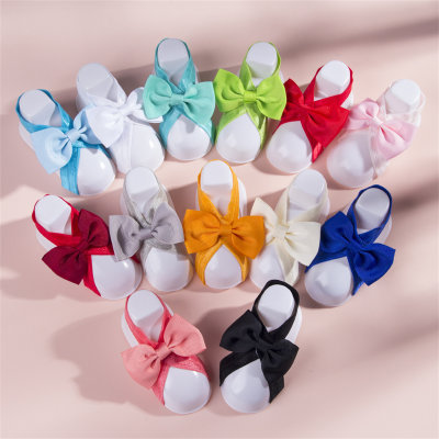 Chaussettes pour bébé avec nœud papillon de couleur unie