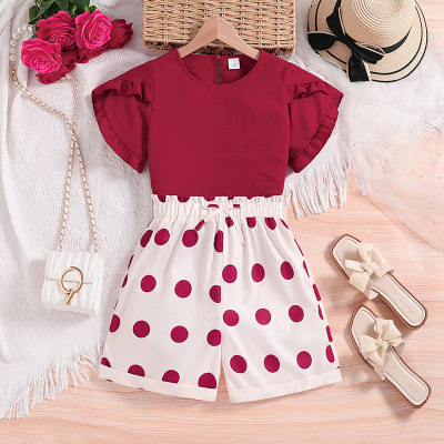 Red short-sleeved top and polka dot shorts two-piece set