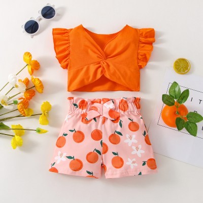 Top de manga com babados estampado laranja bebê e shorts decorativos com laço