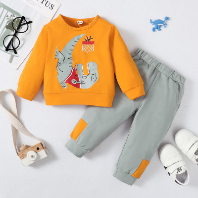 Top de manga larga con estampado de dinosaurio para bebé de 2 piezas y pantalones de lápiz con bloques de color