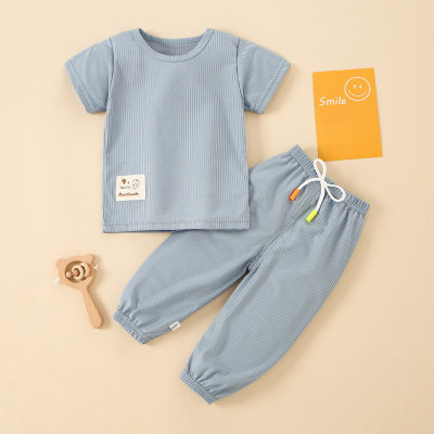 Pijama de pantalón y camiseta informal liso de poliéster y elastano para niño pequeño