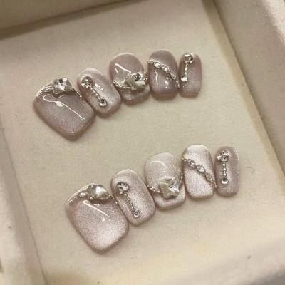 Las uñas Doudou son tomas reales puramente hechas a mano de chicas calientes que muestran uñas que cambian de color con ojos de gato de diamantes con diamantes completos y uñas portátiles parpadeantes.