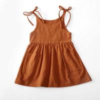 ins European and American girls summer solid color cotton and linen 2 side pocket suspender dress lace-up children's suspender dress  Brown