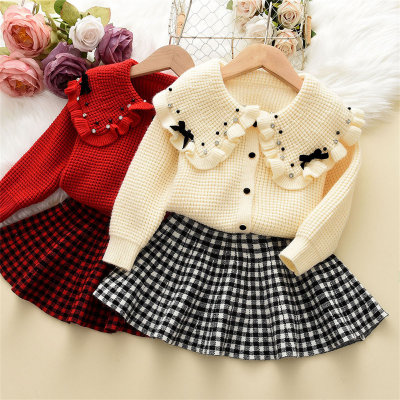 2 pièces bébé fille couleur unie revers à volants Bowknot Decor cardigan tricoté boutonné et jupe plissée à carreaux